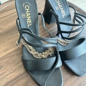 CHANEL Black Leather Strappy Heels with Gold Chain Accent